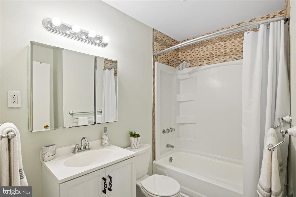 2809 Shiloh Church Road Bryans Road, MD 20616 - Photo 16 of 21 a bathroom with a sink double vanity mirror and a shower