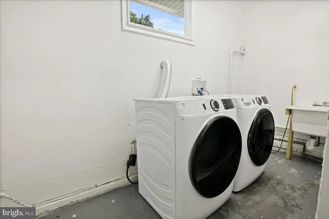 a utility room with dryer and washer