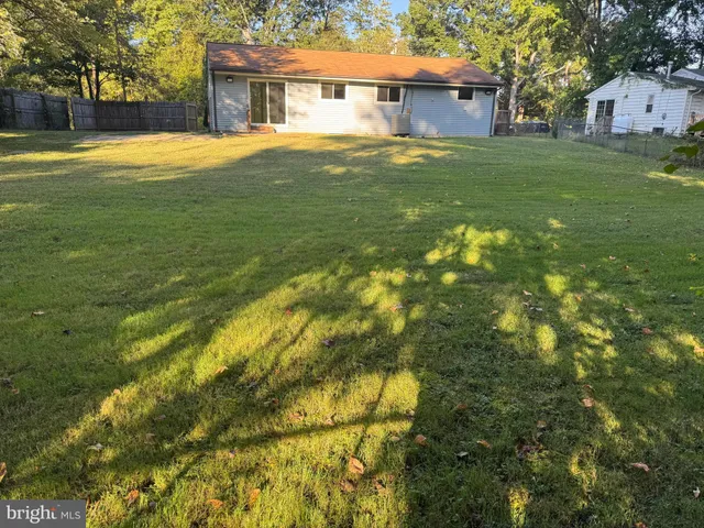 a view of a house with a big yard