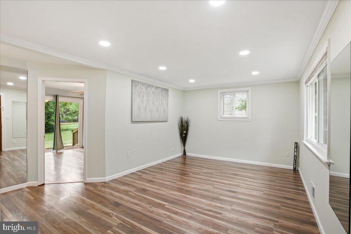 2809 Shiloh Church Road Bryans Road, MD 20616 - Photo 3 of 21 a view of an empty room with wooden floor and a window