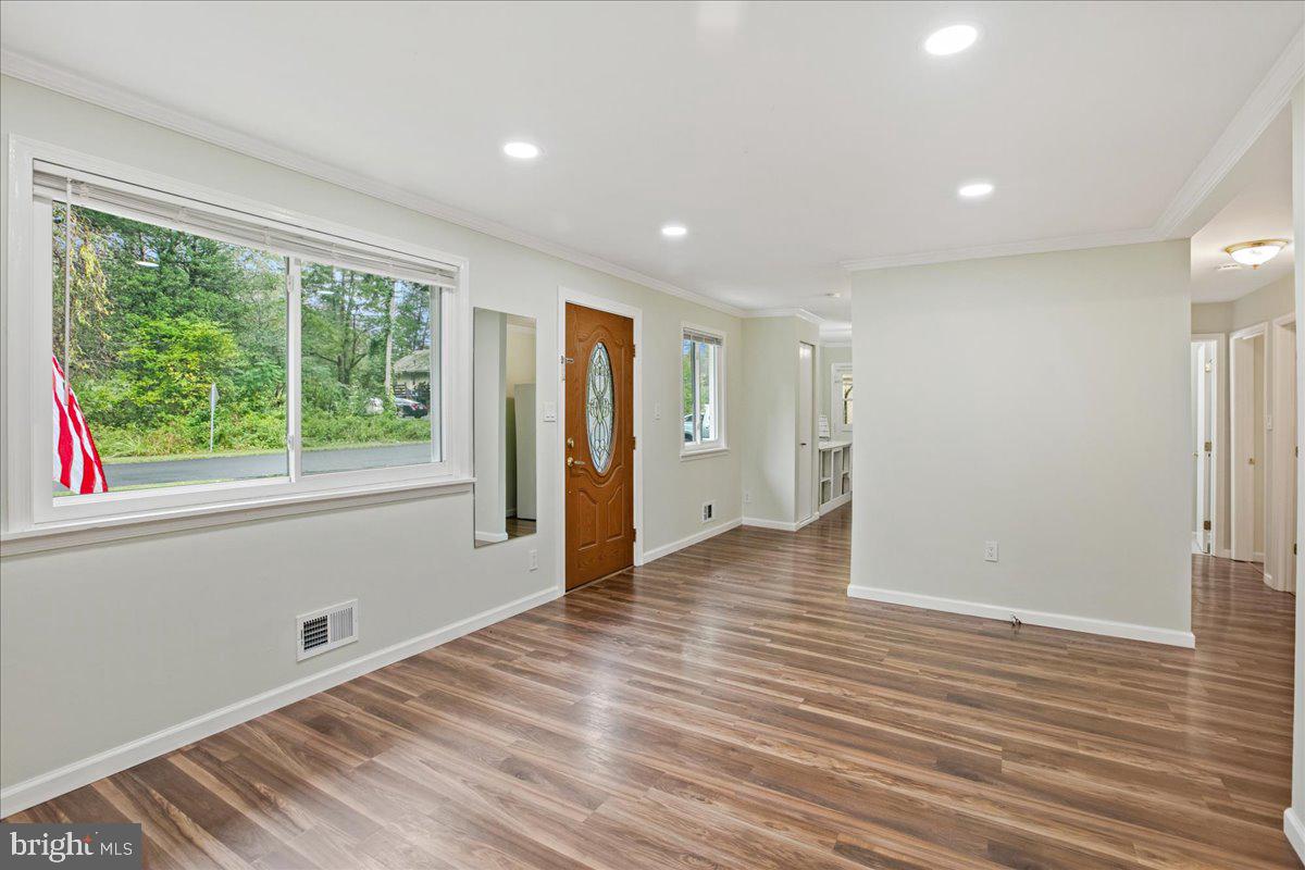 2809 Shiloh Church Road Bryans Road, MD 20616 - Photo 5 of 21 a view of an empty room with wooden floor and a window