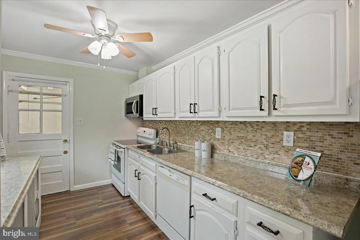 2809 Shiloh Church Road Bryans Road, MD 20616 - Photo 8 of 21 a kitchen with stainless steel appliances granite countertop a sink a stove and cabinets