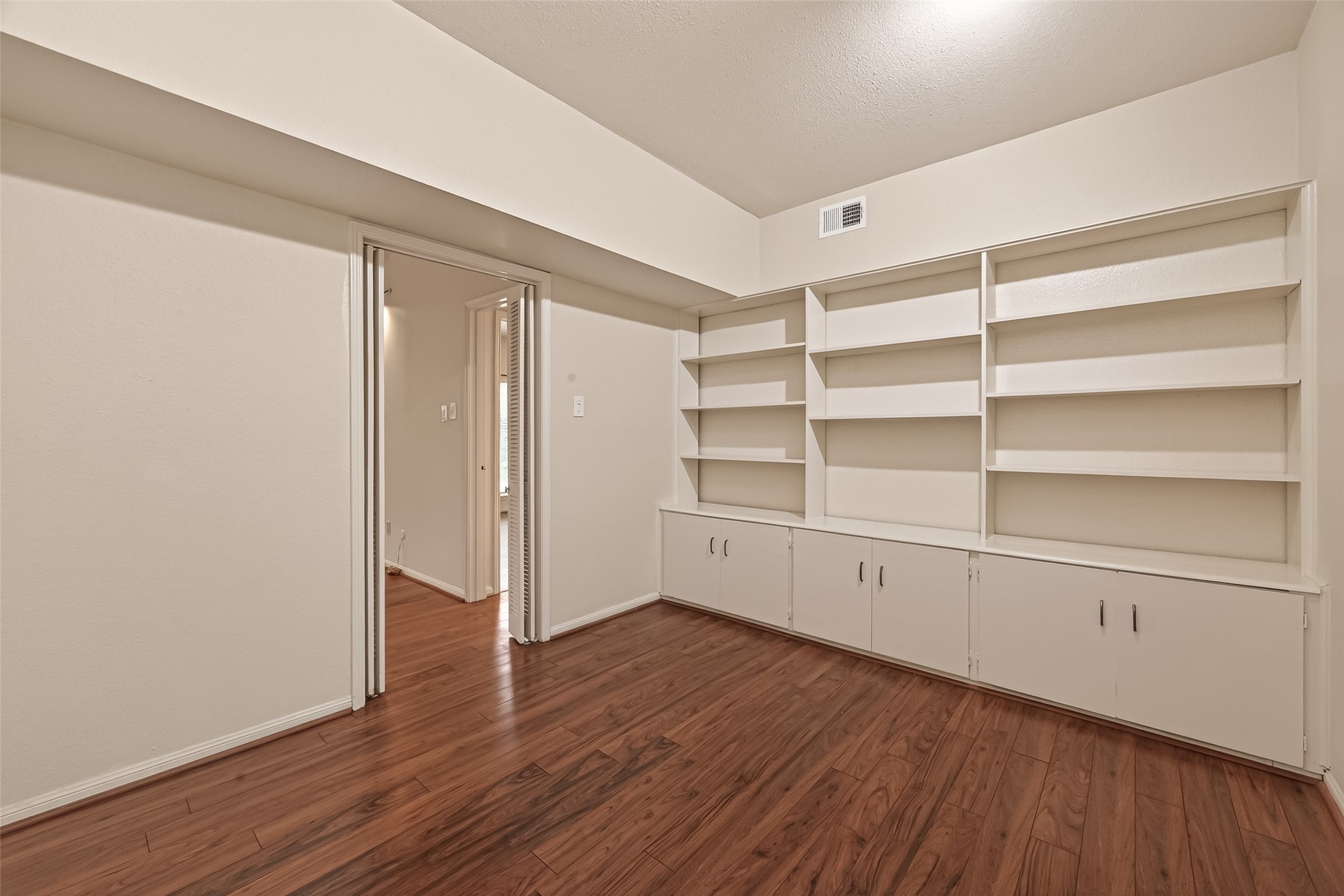 2100 Tanglewilde Street, Unit 596 Houston, TX 77063 - Photo 15 of 32 This unit has a great study with wall of shelving & cabinets