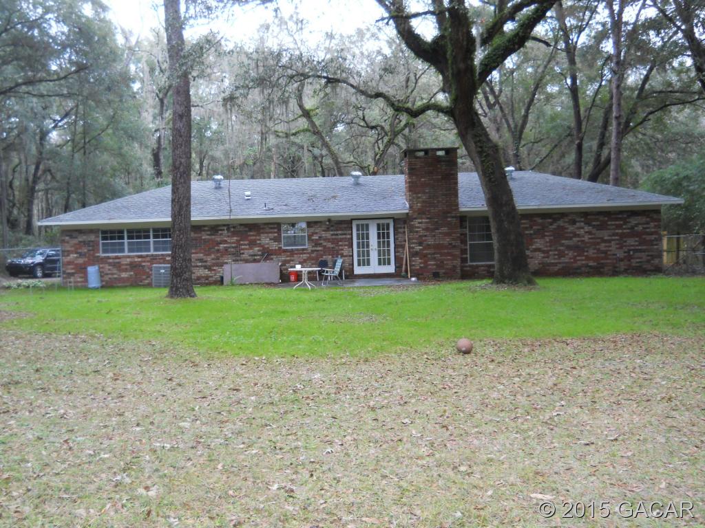 8921 Southwest 8th Avenue Gainesville, FL 32607 - Photo 2 of 24 Rear