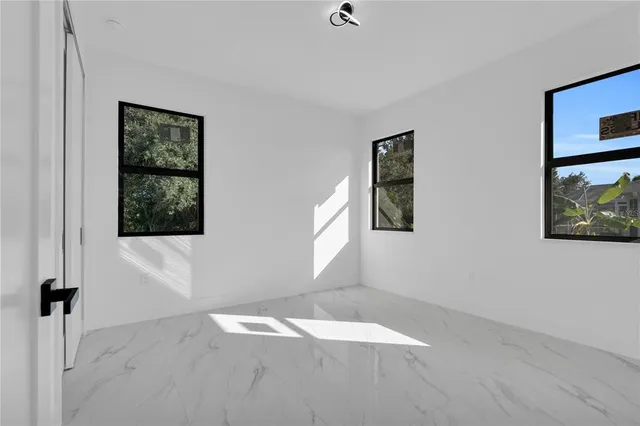 a view of an empty room with a window