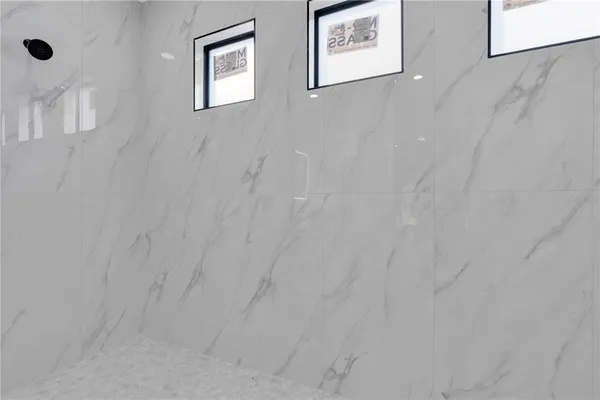 a view of a hallway with two white wall next to a white wall