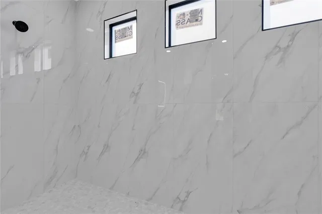 a view of a hallway with two white wall next to a white wall