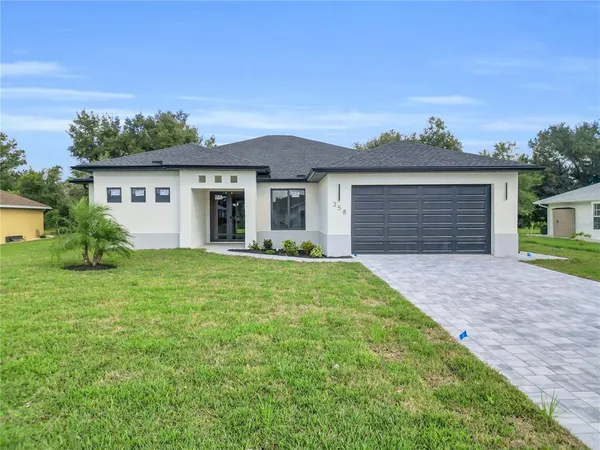 front view of a house with a yard