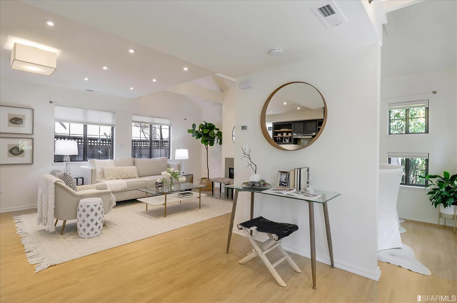 1397 Delaware Street Berkeley, CA 94702 - Photo 1 of 43 a living room with a couch and a potted plant
