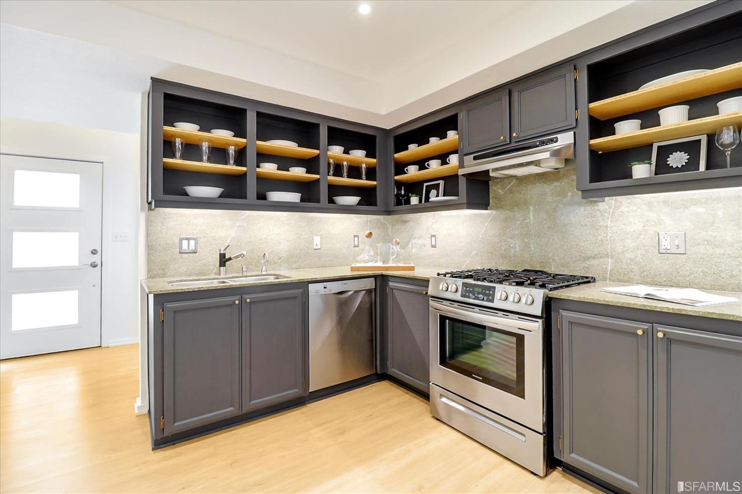 1397 Delaware Street Berkeley, CA 94702 - Photo 17 of 43 a kitchen with stainless steel appliances granite countertop a stove and a sink