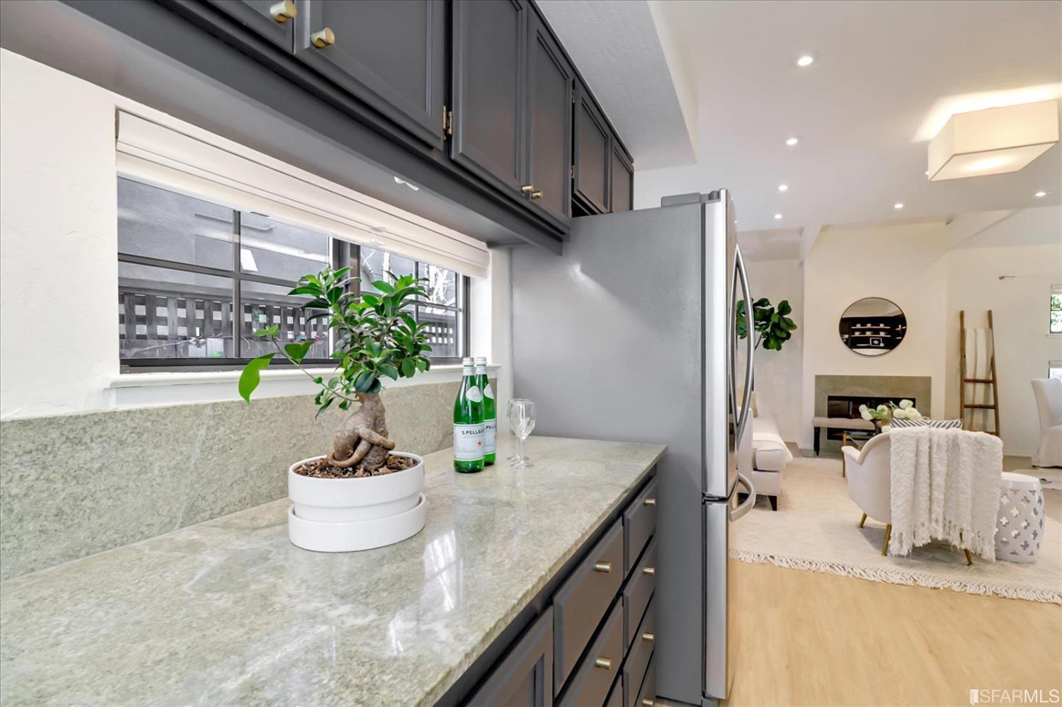 1397 Delaware Street Berkeley, CA 94702 - Photo 18 of 43 a view of a kitchen with dining table and chairs