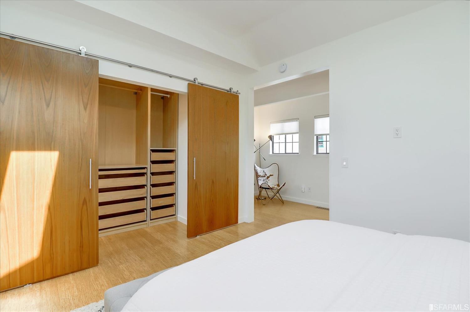 1397 Delaware Street Berkeley, CA 94702 - Photo 23 of 43 a bedroom with a bed and wooden floor