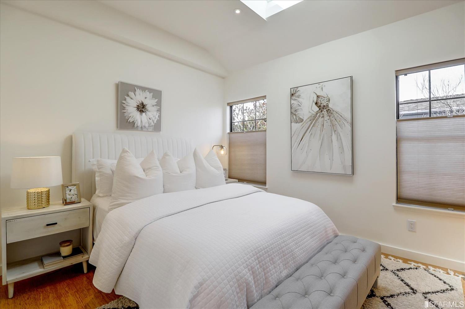 1397 Delaware Street Berkeley, CA 94702 - Photo 24 of 43 a bedroom with a bed and a painting on the wall