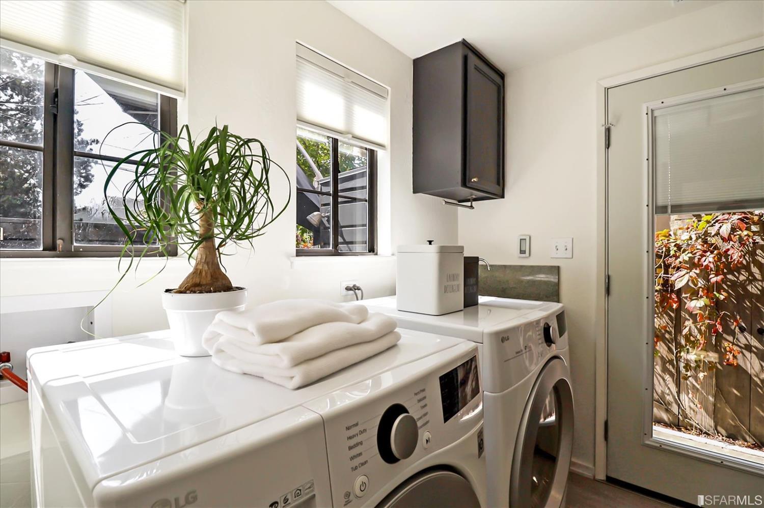 1397 Delaware Street Berkeley, CA 94702 - Photo 32 of 43 a living room with furniture and a flat screen tv