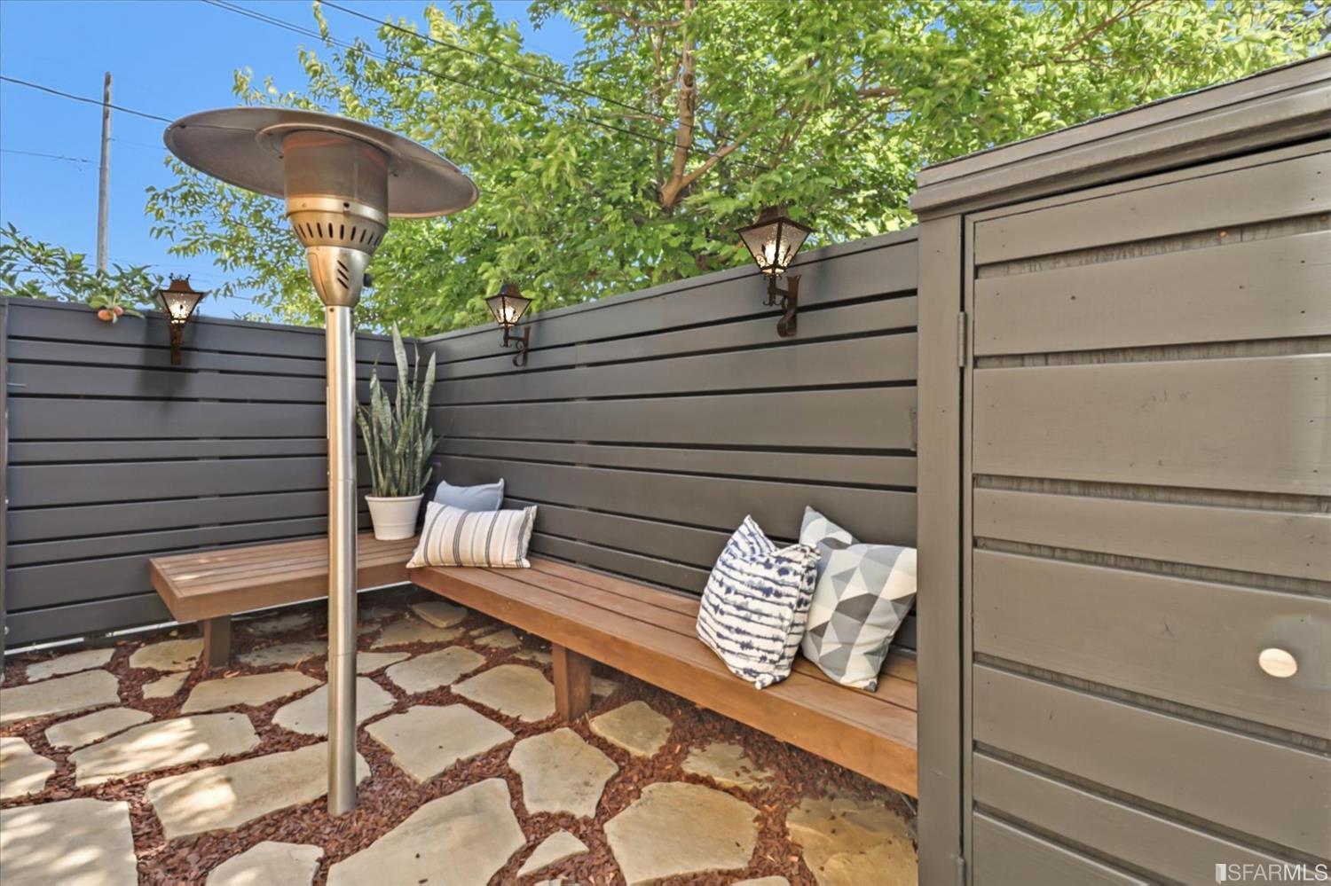 1397 Delaware Street Berkeley, CA 94702 - Photo 33 of 43 a view of a bench in back yard of the house