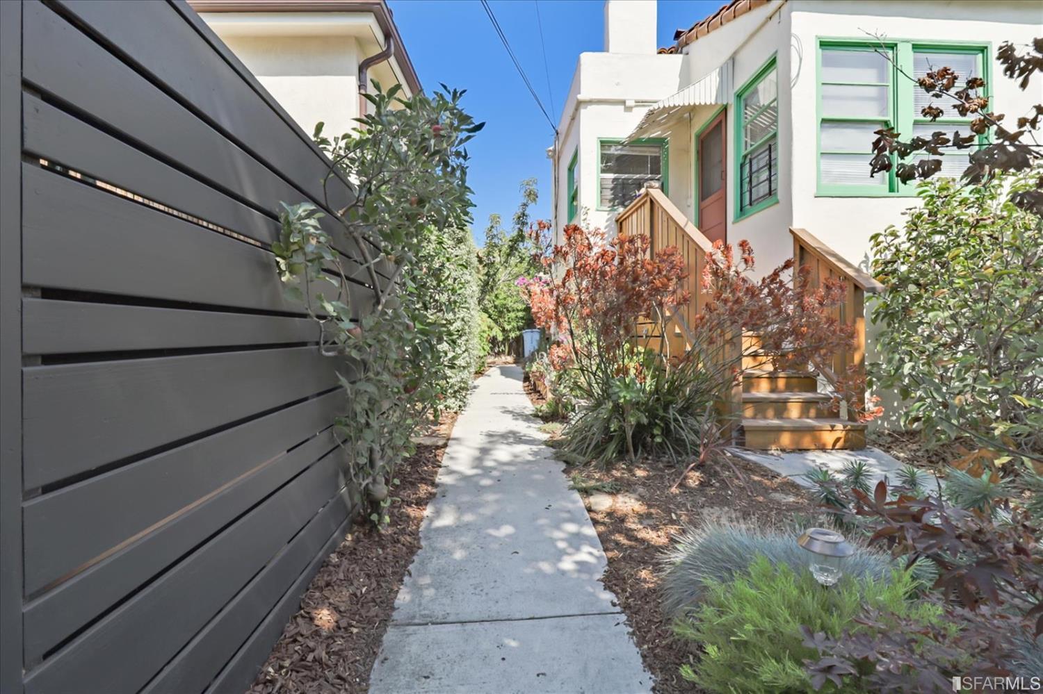 1397 Delaware Street Berkeley, CA 94702 - Photo 36 of 43 a pathway of a house with a yard