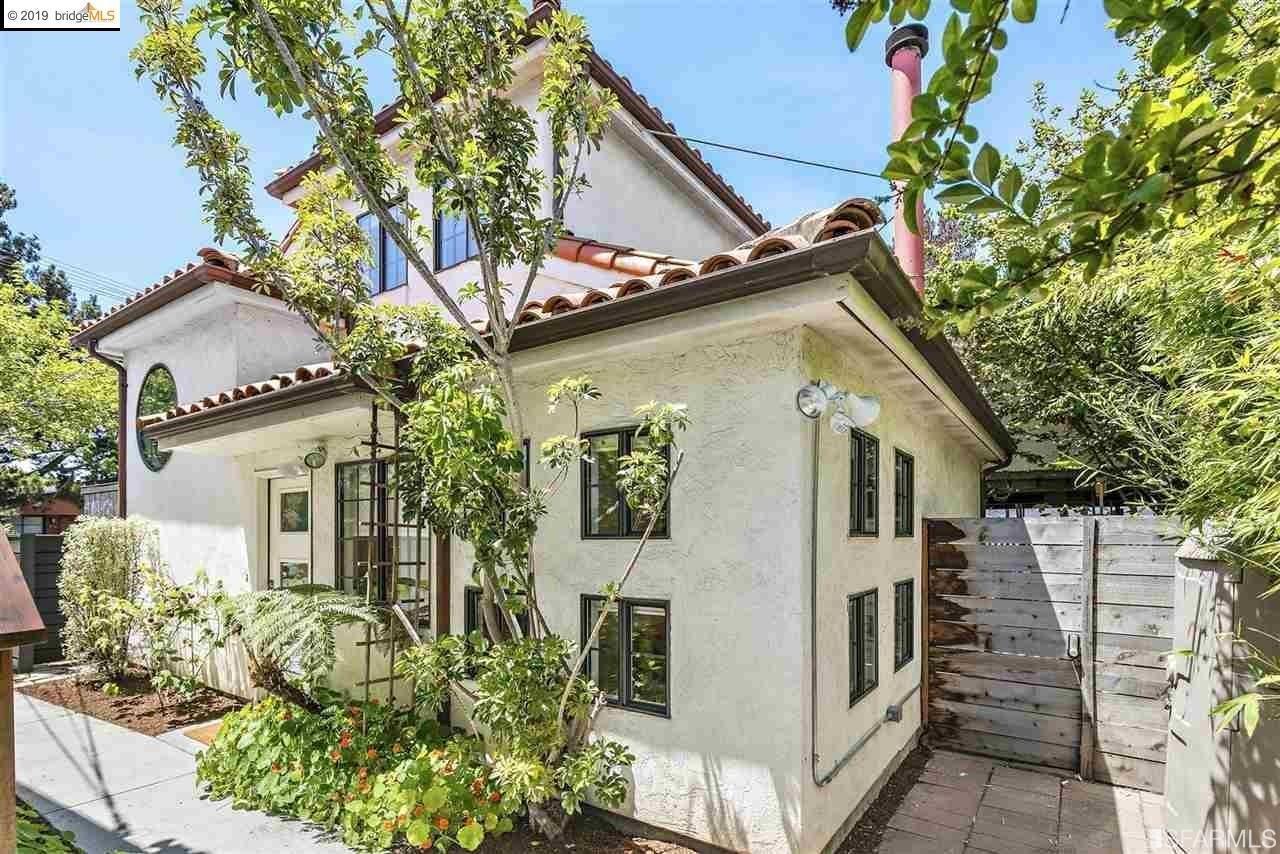 1397 Delaware Street Berkeley, CA 94702 - Photo 37 of 43 a yellow house with trees in front of it