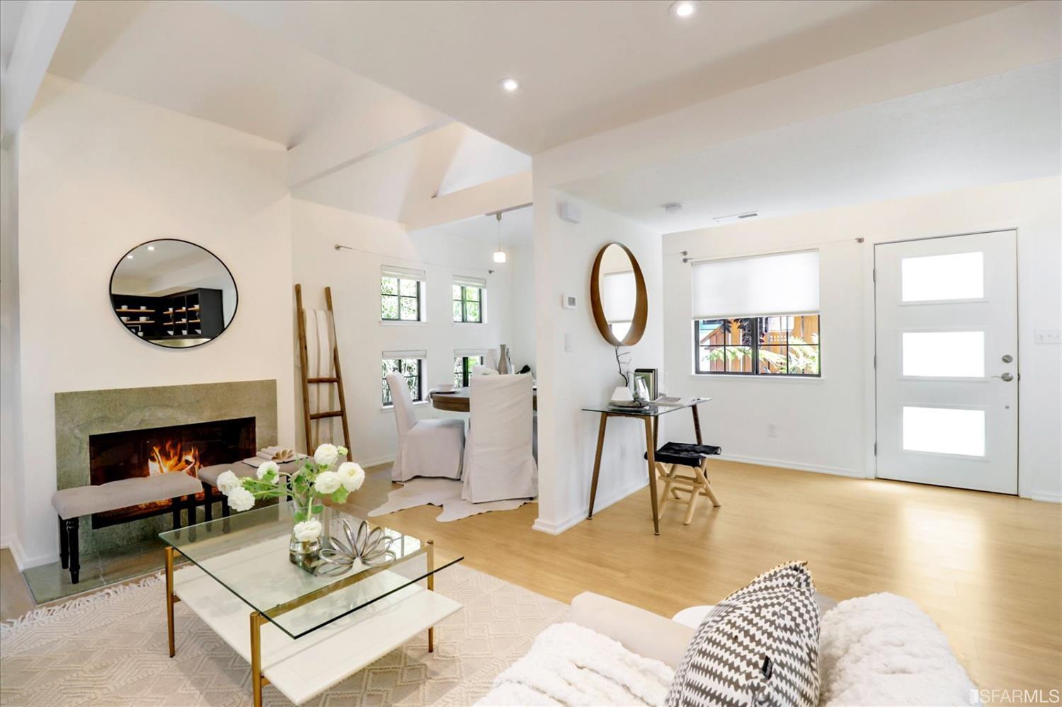 1397 Delaware Street Berkeley, CA 94702 - Photo 5 of 43 a living room with furniture a fireplace and a window