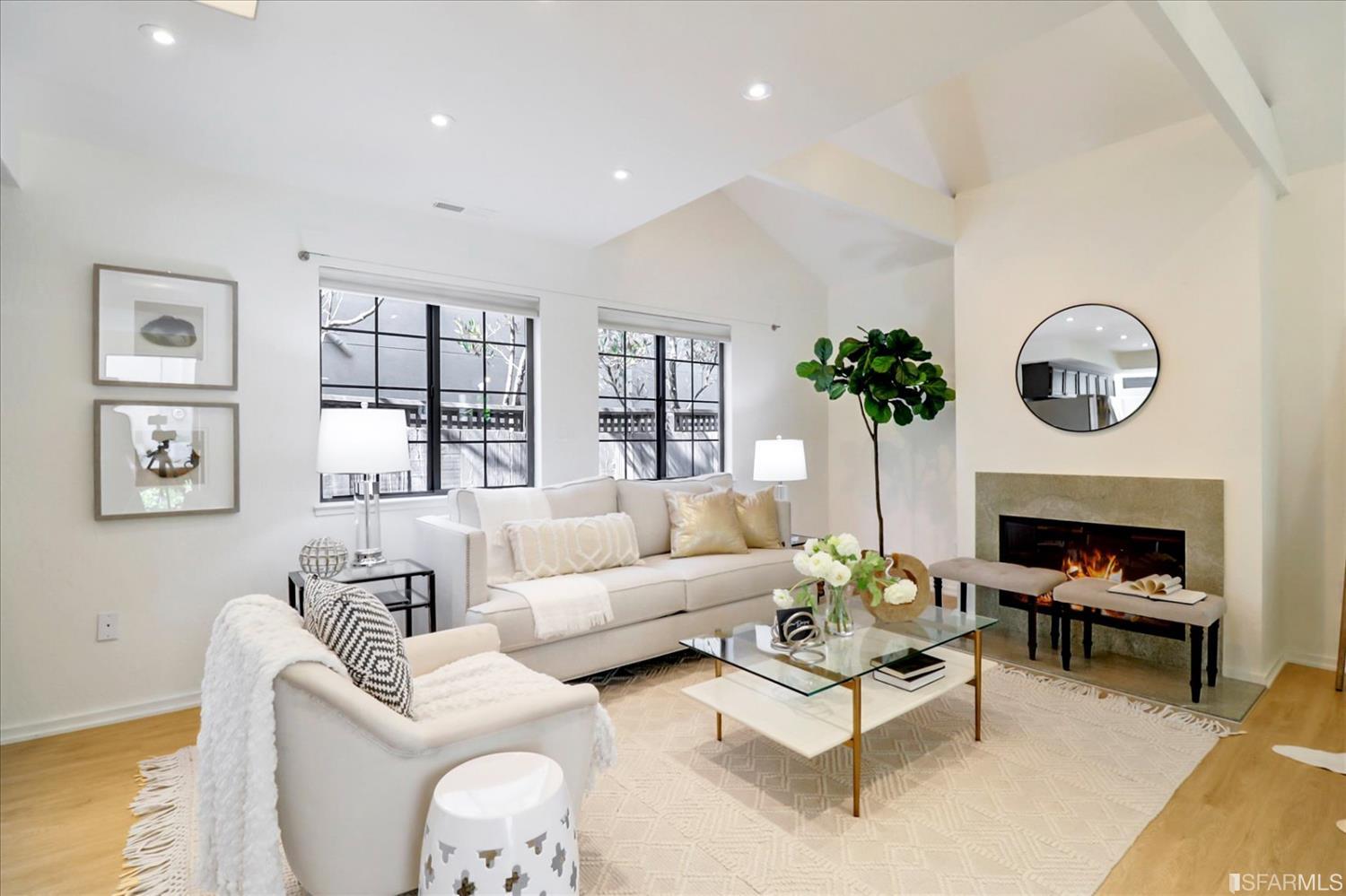 1397 Delaware Street Berkeley, CA 94702 - Photo 7 of 43 a living room with furniture a fireplace and a potted plant