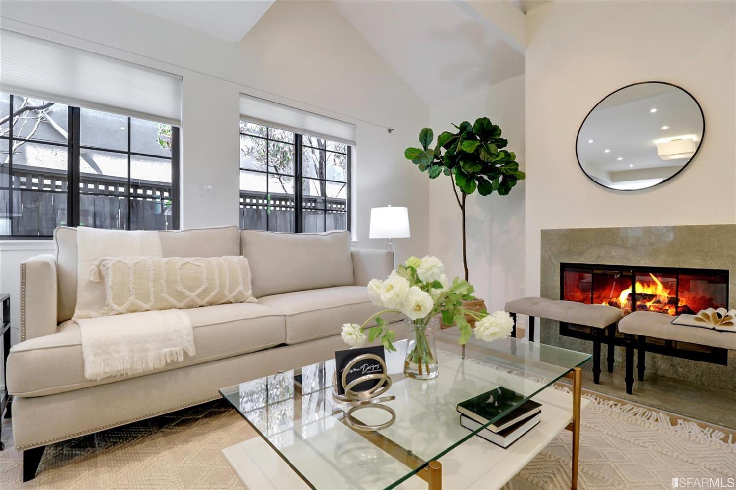 1397 Delaware Street Berkeley, CA 94702 - Photo 8 of 43 a living room with furniture a potted plant and a fireplace