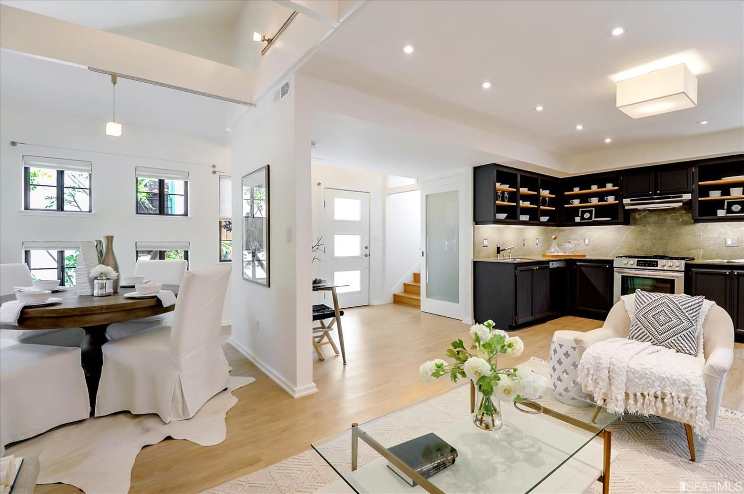 1397 Delaware Street Berkeley, CA 94702 - Photo 9 of 43 a living room with furniture kitchen view and a chandelier
