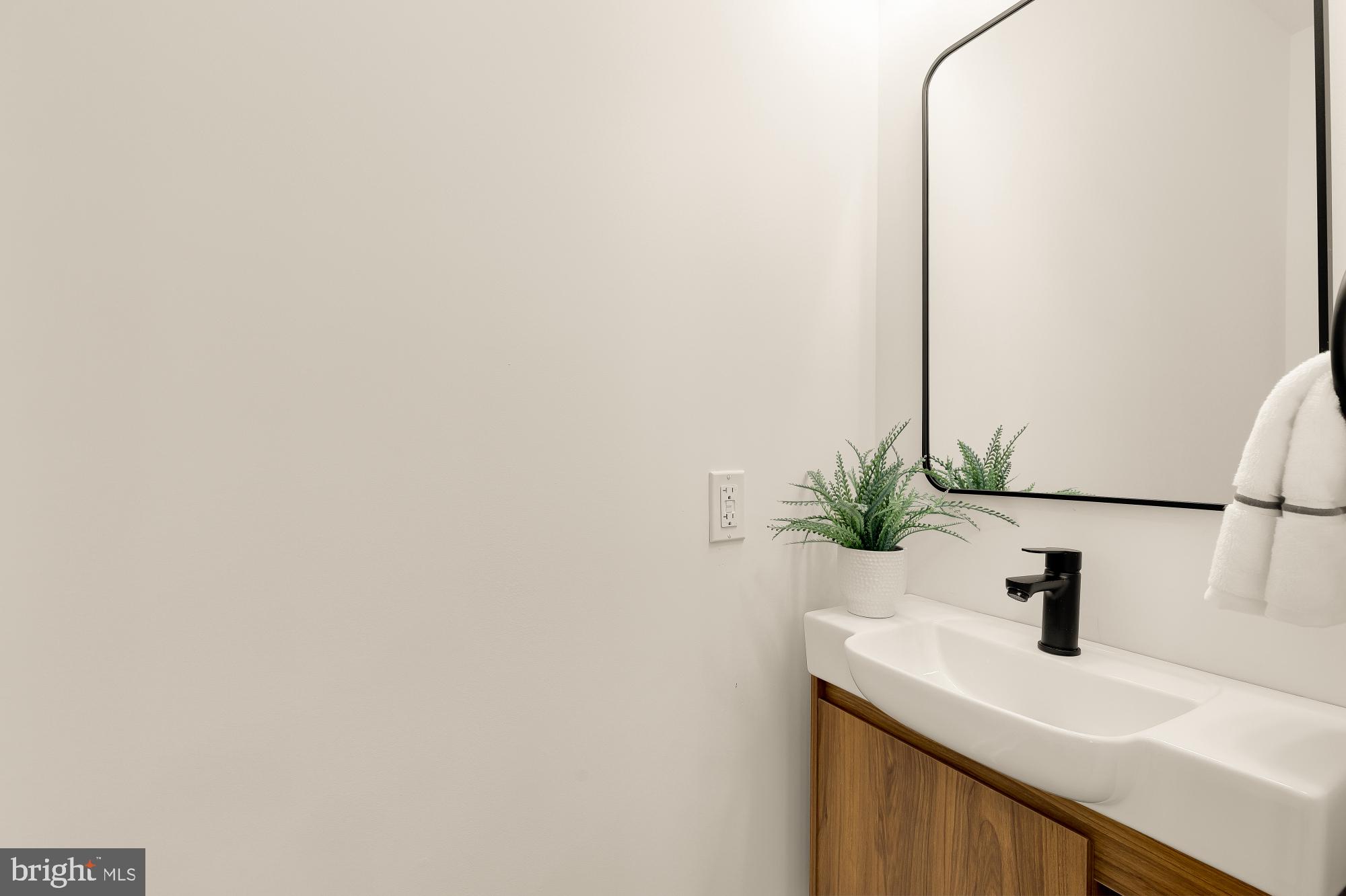 1710 2nd Street Northwest Washington, DC 20001 - Photo 15 of 37 Sleek modern bathroom with natural touches.