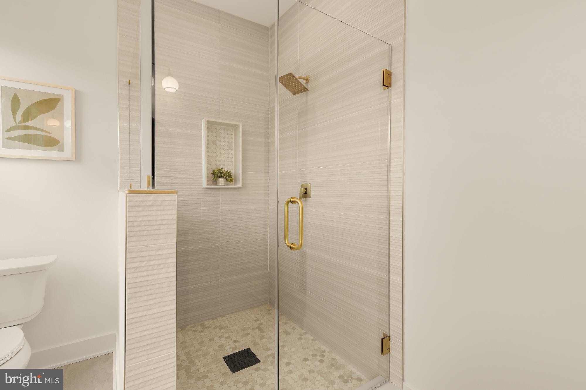 1710 2nd Street Northwest Washington, DC 20001 - Photo 19 of 37 Elegant glass shower with gold accents.