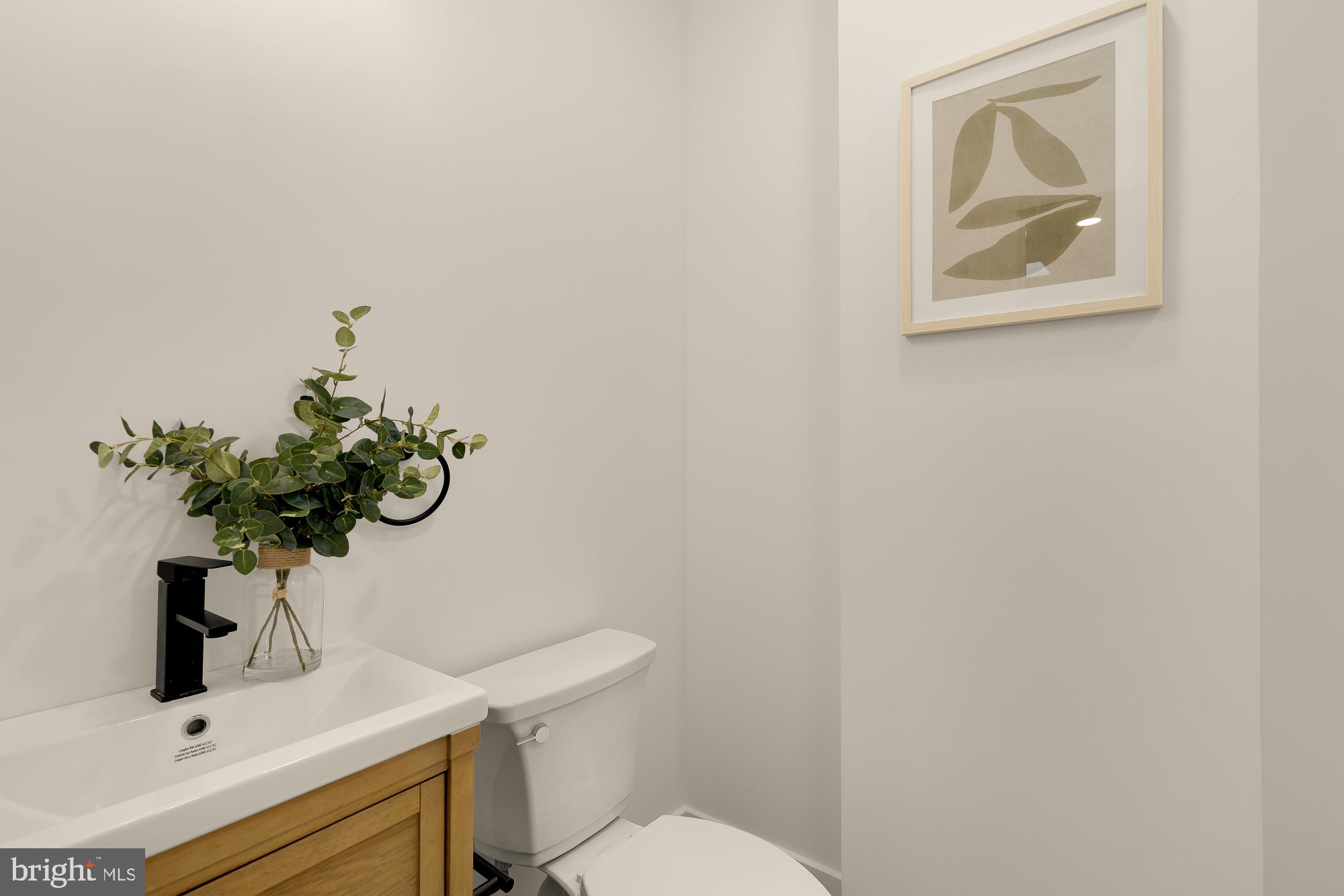1710 2nd Street Northwest Washington, DC 20001 - Photo 27 of 37 Chic half-bath with modern accents.