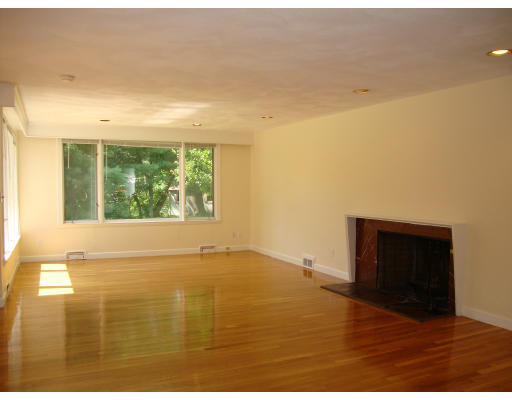 51 Cleveland Road Brookline, MA 02467 - Photo 6 of 15 a view of an empty room with wooden floor and a window