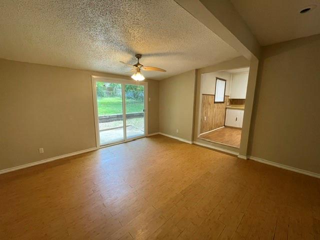 845 Rumfield Road White Settlement, TX 76108 - Photo 13 of 19 an empty room with windows and chandelier fan