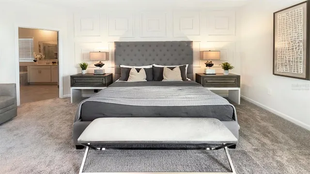 a bedroom with bed and a couch