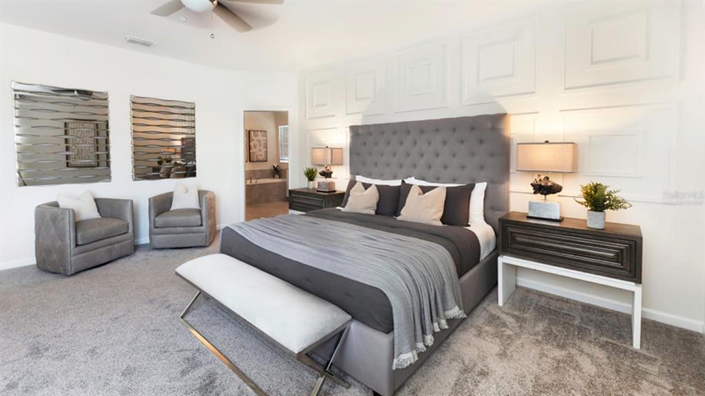 2572 Rider Rain Lane Apopka, FL 32703 - Photo 17 of 26 a bedroom with bed and a couch