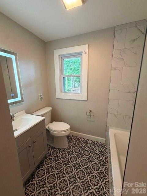 1450 3rd Street Southwest Hickory, NC 28602 - Photo 9 of 17 a bathroom with a toilet a sink a shower a window and vanity