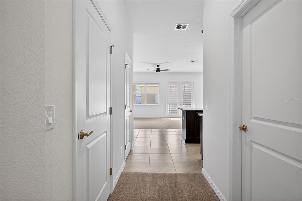 810 MIDDLETON Street DeBary, FL 32713 - Photo 16 of 52 a view of a hallway with white walls and entryway
