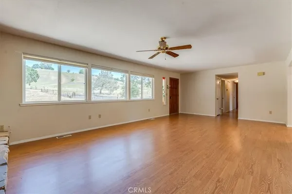 a kitchen with stainless steel appliances granite countertop wooden cabinets a sink and a stove