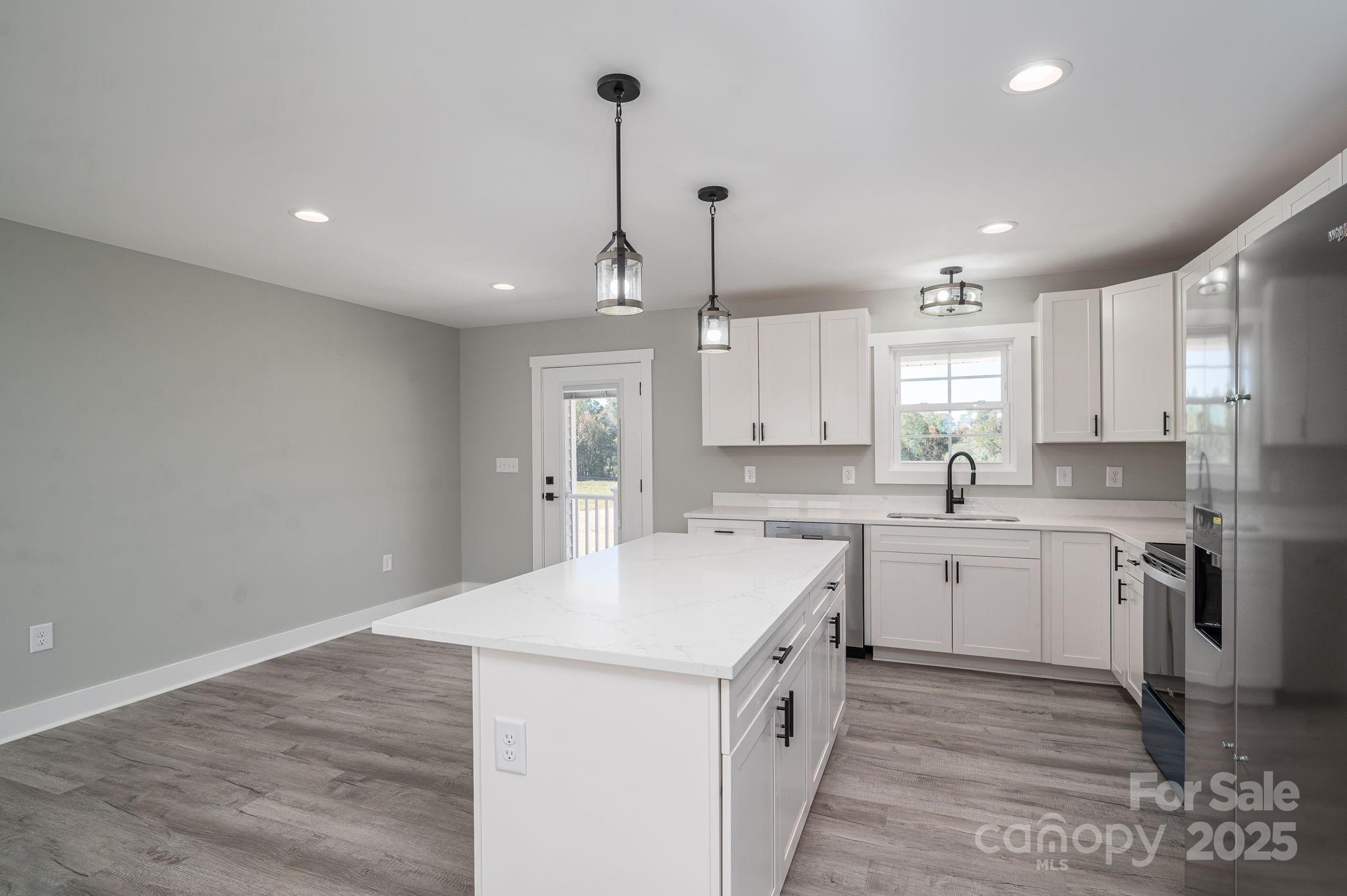 367 Northbrook III School Road Vale, NC 28168 - Photo 16 of 40 a kitchen with a sink stove and cabinets