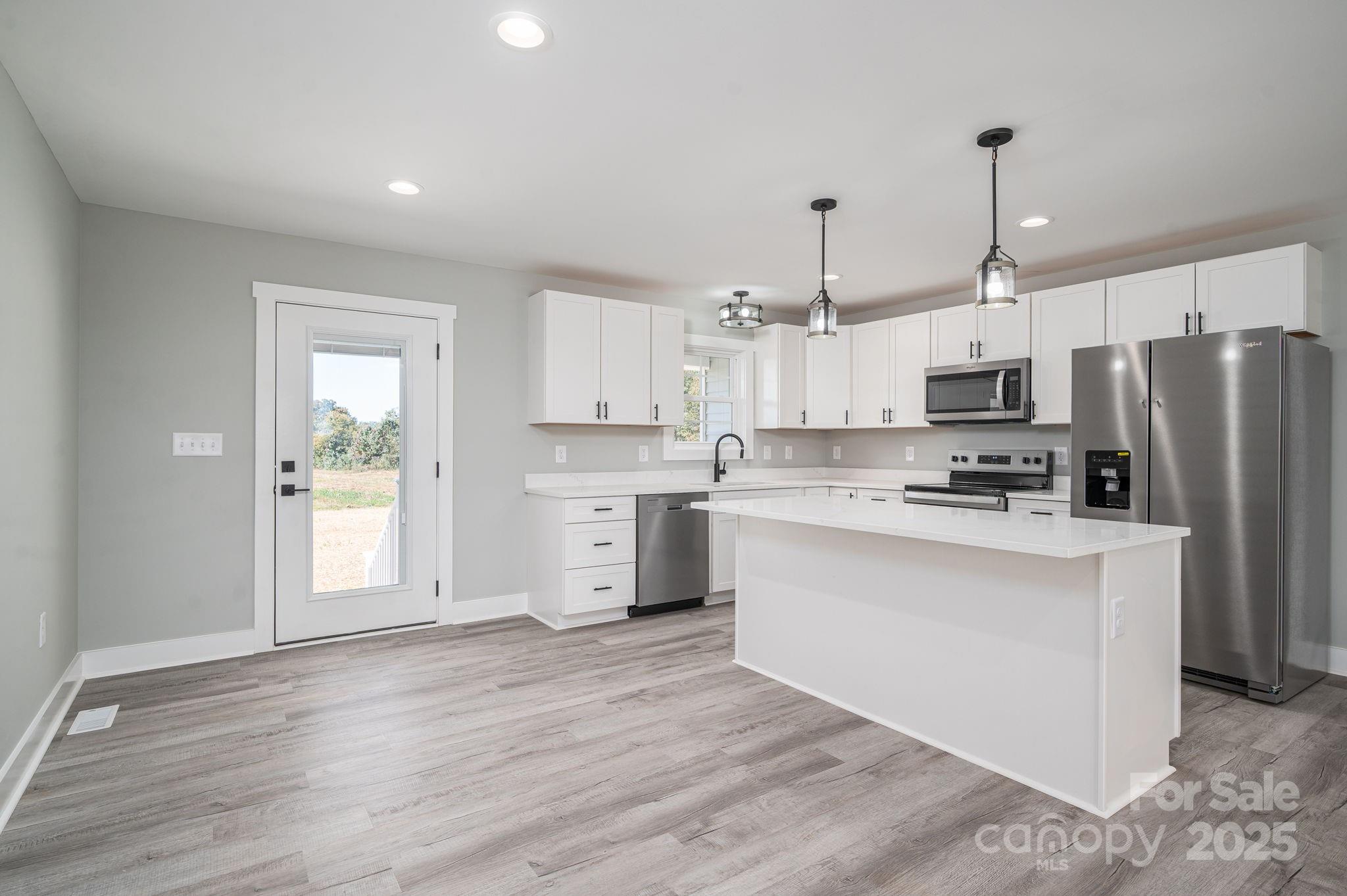 367 Northbrook III School Road Vale, NC 28168 - Photo 20 of 40 a kitchen with stainless steel appliances a refrigerator sink and microwave