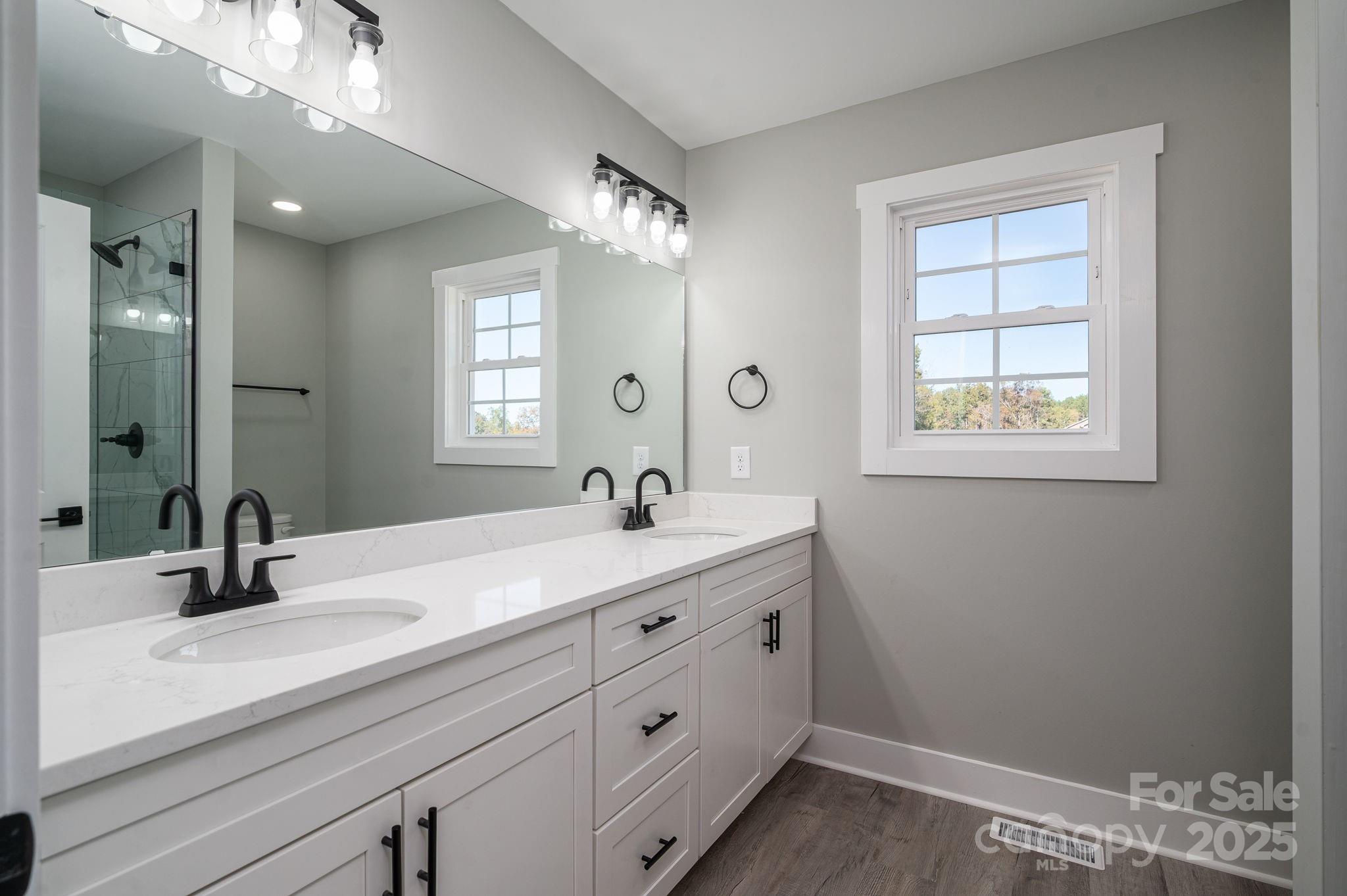 367 Northbrook III School Road Vale, NC 28168 - Photo 25 of 40 a bathroom with a double vanity sink and a mirror