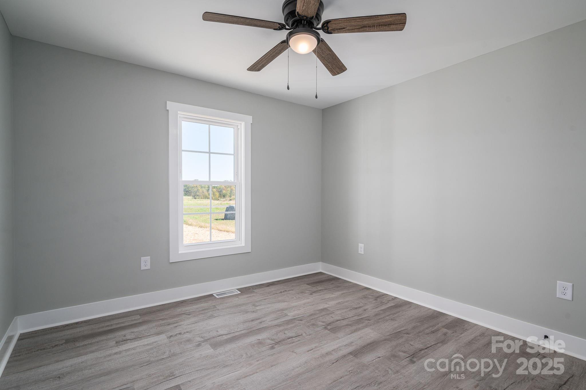 367 Northbrook III School Road Vale, NC 28168 - Photo 28 of 40 wooden floor in an empty room with a window