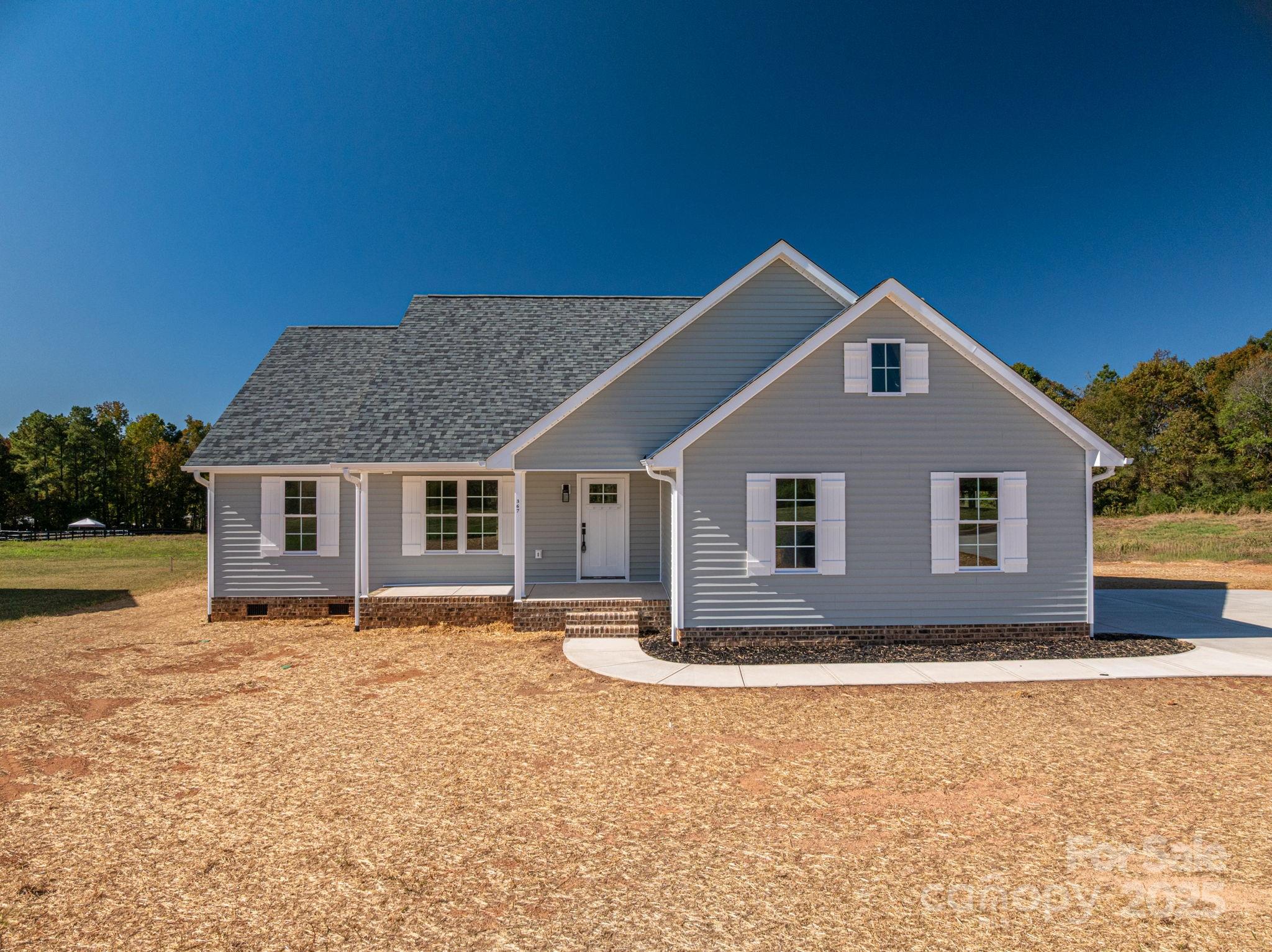 367 Northbrook III School Road Vale, NC 28168 - Photo 4 of 40 a house with trees in the background