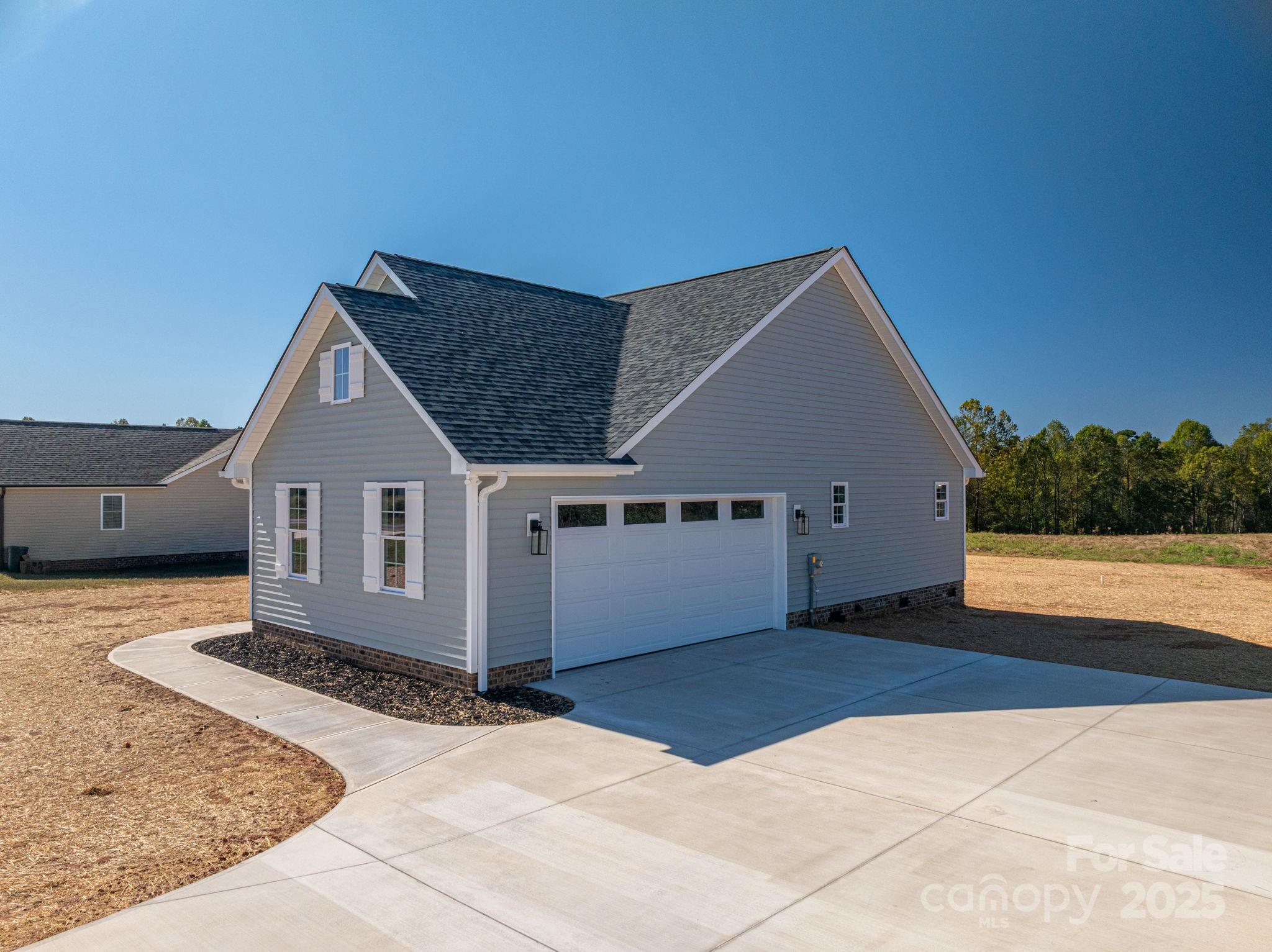 367 Northbrook III School Road Vale, NC 28168 - Photo 6 of 40 a house view with a garden space