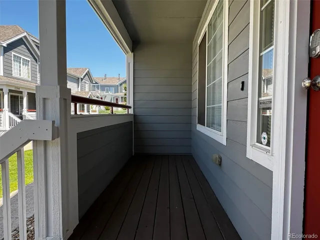 a view of balcony and wooden floor