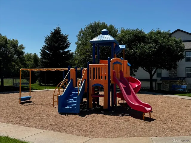a swimming pool with outdoor seating and yard