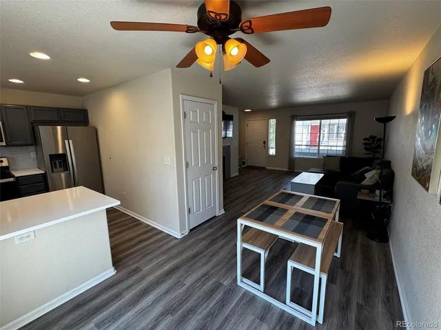 a kitchen with stainless steel appliances a stove a refrigerator and cabinets