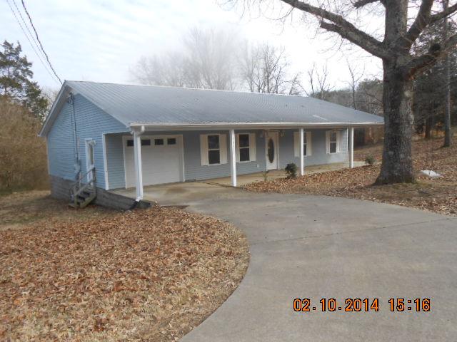 10210 New Hope Road Bon Aqua, TN 37025 - Photo 1 of 16 FRONT HAS LARGE COVERED FRONT PORCH AND AN ATTACHED GARAGE