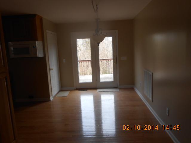 10210 New Hope Road Bon Aqua, TN 37025 - Photo 7 of 16 DINING ROOM HAS PATIO DOORS LEADING TO DECK. HARDWOOD FLOORS