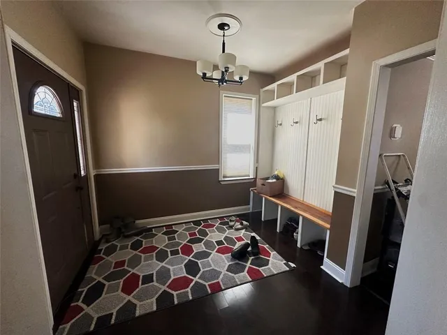 a kitchen with lots of counter top space and wooden floor