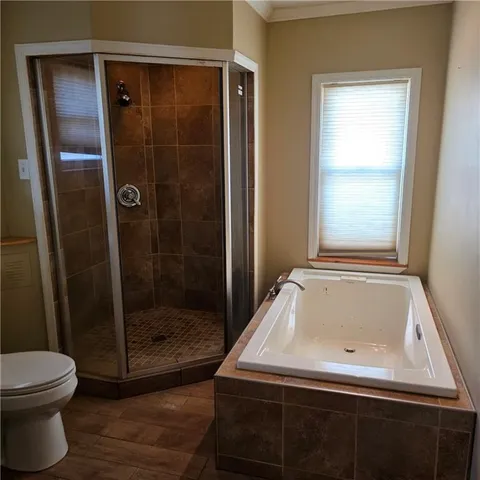 a bathroom with a toilet a sink and a mirror