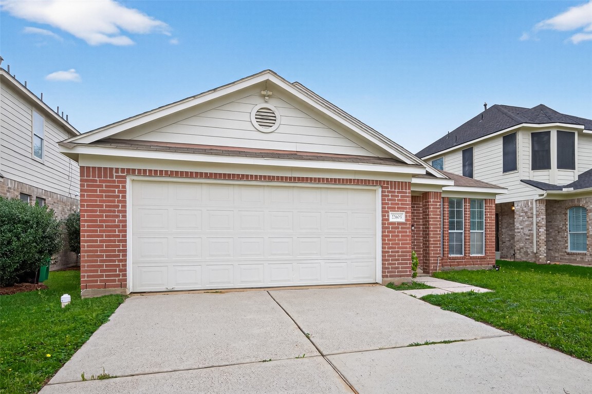 22603 Spring Crossing Drive Spring, TX 77373 - Photo 1 of 29 front view of house with a yard