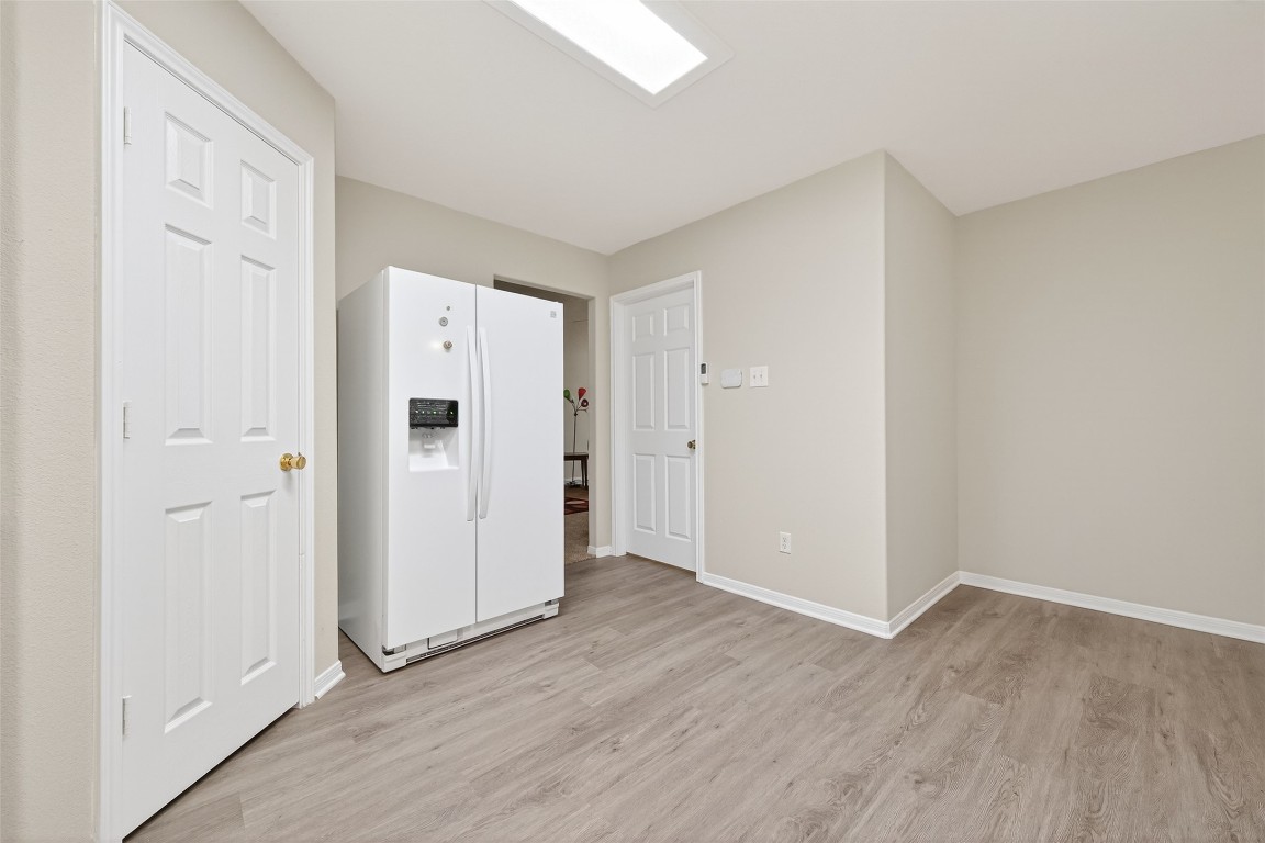 22603 Spring Crossing Drive Spring, TX 77373 - Photo 11 of 29 an empty room with wooden floor